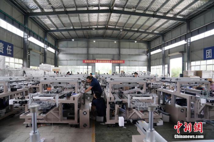 資料圖：工人在車間忙碌。
<a target='_blank' href='http://www.chinanews.com/'>中新社</a>記者 蘇丹 攝